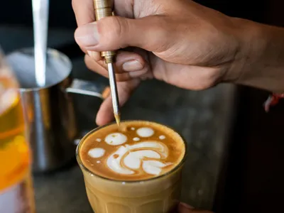 Latte with rosetta art in a ceramic cup